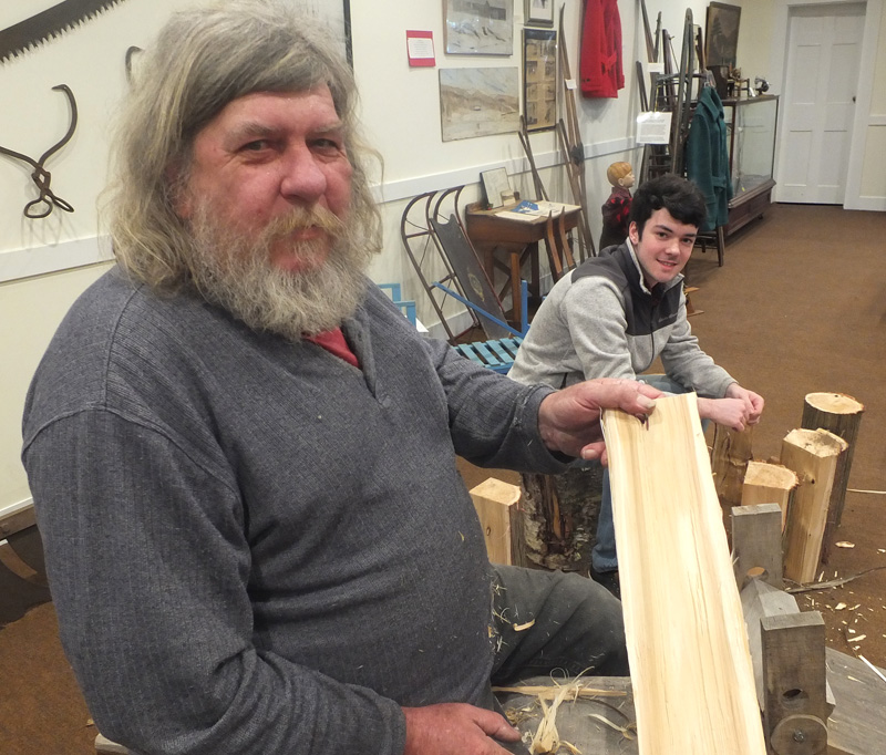 Martin Stanley and Tyler Bilodeau make shingles the old fashioned way; by hand. (Photo by Chris Wolf)