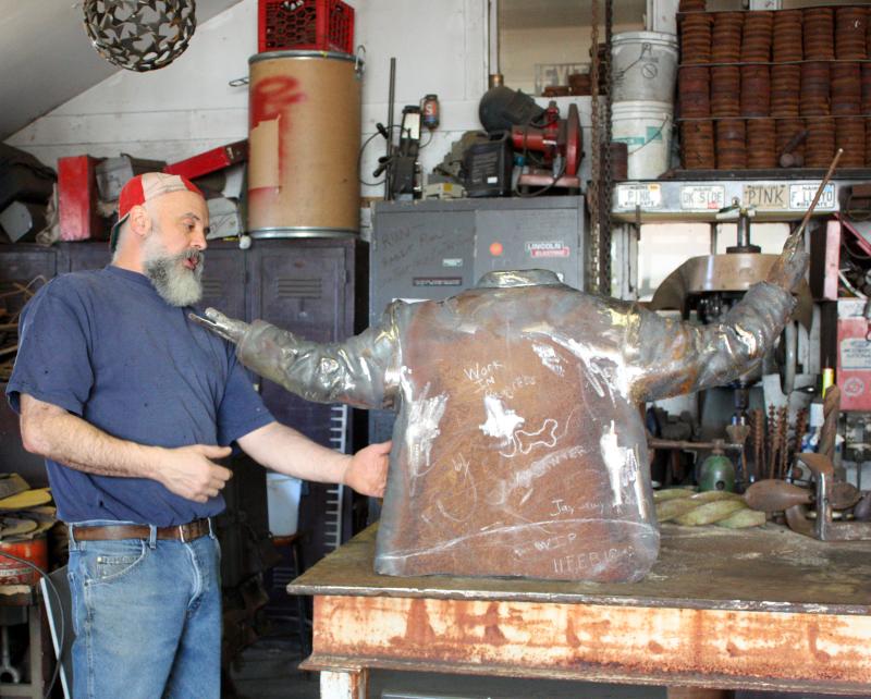 Artist Jay Sawyer in his Stemwinder Studio in Warren with his latest commissioned work-in-progress, ‘The Maestro.’ (Photo by Holly S. Edwards)