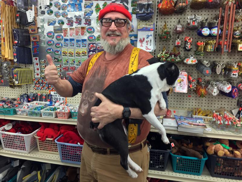 Big Al is a force of nature. Here he is with his second best friend, Lily, at his store in Wiscasset. SUZI THAYER/Boothbay Register