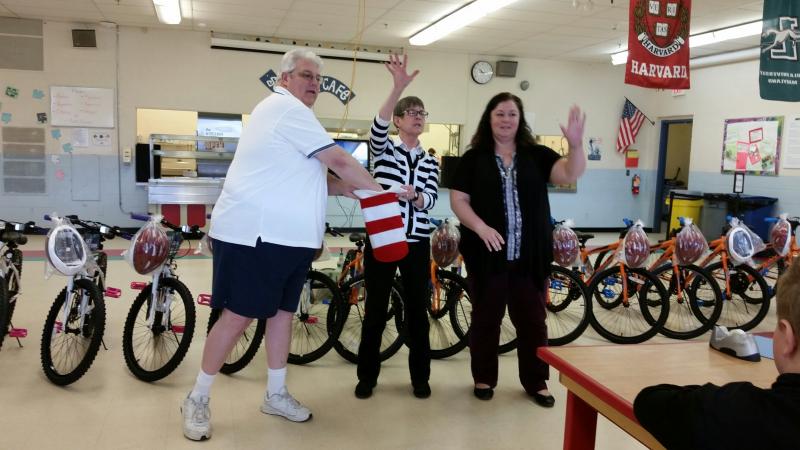Mason Jeff Sukeforth, Librarian Kathy Foss and Principal Jaime Stone led the charge with drawing the winning raffle tickets.