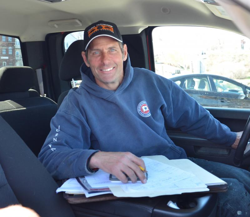 Brad Scott, a fisherman and waterfront contractor, reviews work plans on the Camden Harbor. (Photo by Lynda Clancy)