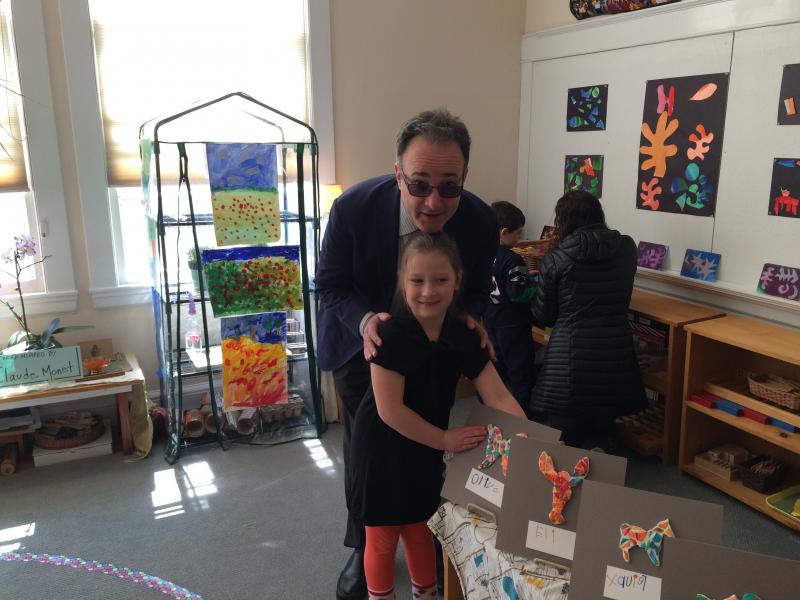Student Olive Pine with her dad, Ted next to artwork in the style of Antoni Gaudi