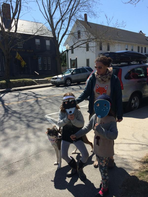 Students Sophie Turek and Celia Wilton with Celia's mom Jen Marshall and their dog, Rashee.