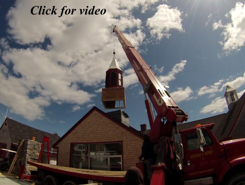 From the ground to the top of the building, a new steeple gets set into place.