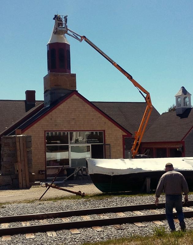 From the ground to the top of the building, a new steeple gets set into place.