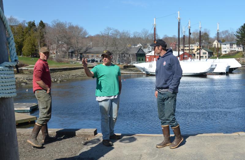 Adam Scott, Camden Harbor Master Steve Pixley and Brad Scott, at the Camden waterfront. (Photo by Lynda Clancy)
