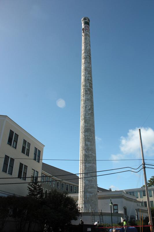 The Knox Mill is located along Mechanic Street, and the smokestack can be seen in its entirety from Washington Street. This photo is from September 2014, when work to restore and strengthen the tower got underway. (Photo by Holly S. Edwards)