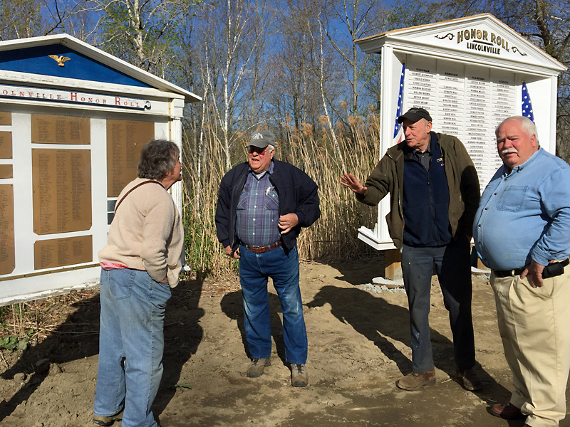 From left, Diane O’Brien, Cecil Dennison, Rosey Gerry and Sandy Delano hold an impromptu discussion about whose names might eventually appear on the final version of the new Honor Roll. (Photo by Holly S. Edwards)