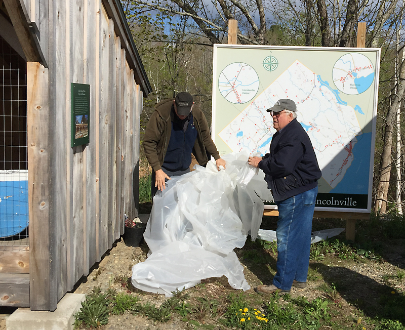 Rosey Gerry and Cecil Dennison uncover the historical home map. (Photo by Holly S. Edwards)