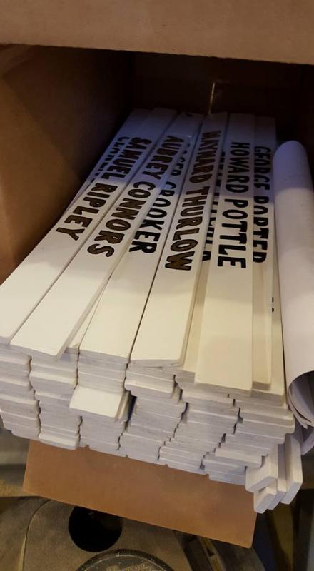Walt Simmons painted new nameplates for all 115 WWII veterans.
Photo by Corey Dennison memorial