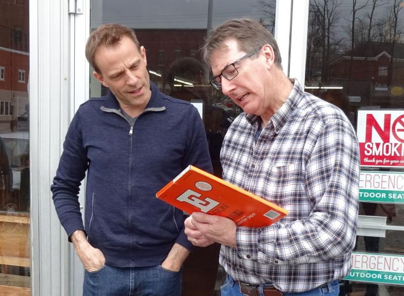 Furrier (right) and fellow typewriter lover Arthur Grau check out vintage typewriter paper. (photo by Erica Thoms)