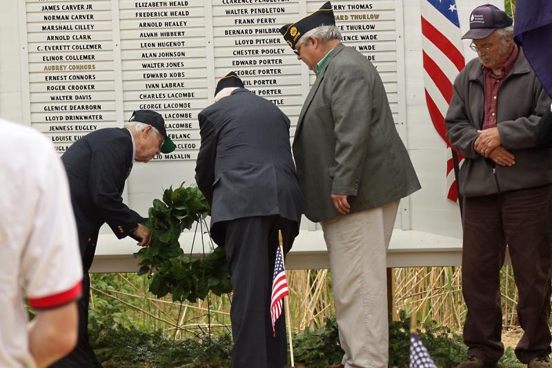 World War II veterans Alan Thomas (U.S. Navy) and Dale Hyssong (U.S. Army) lay a wreath on the Lincolnville Honor Roll during the town’s Memorial Day observance on May 30. With Thomas and Hyssong is American Legion Post District 6 Commander Ray Lewis. (Photos by Holly S. Edwards)