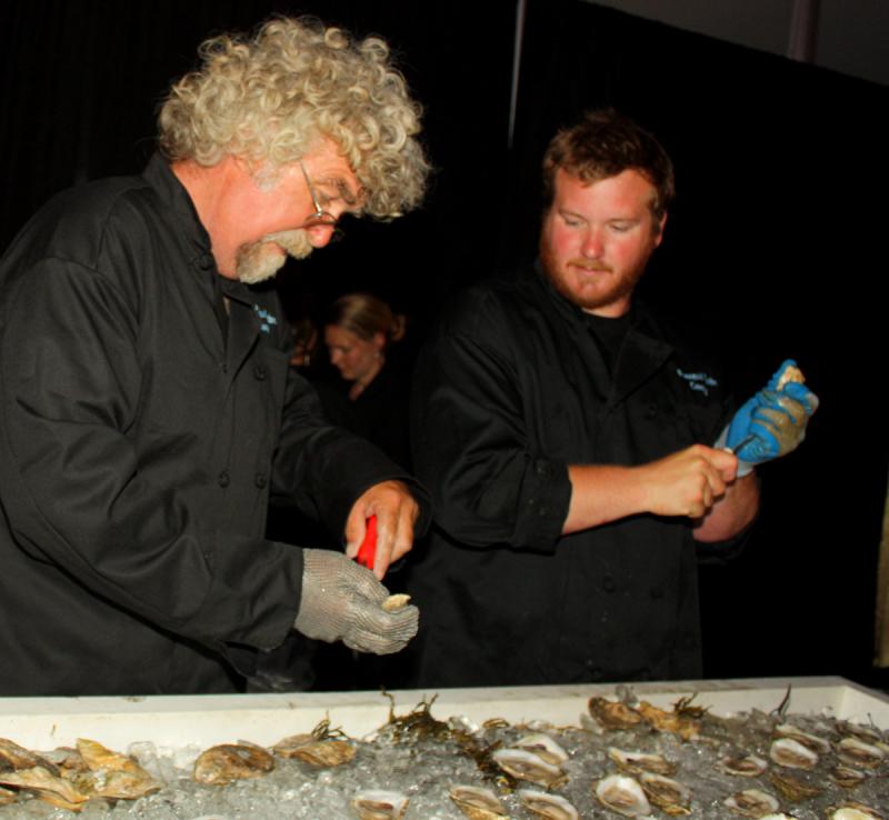 The Pemaquid Oyster Company crew keeps the shucked oysters coming. (Photo by Holly S. Edwards)