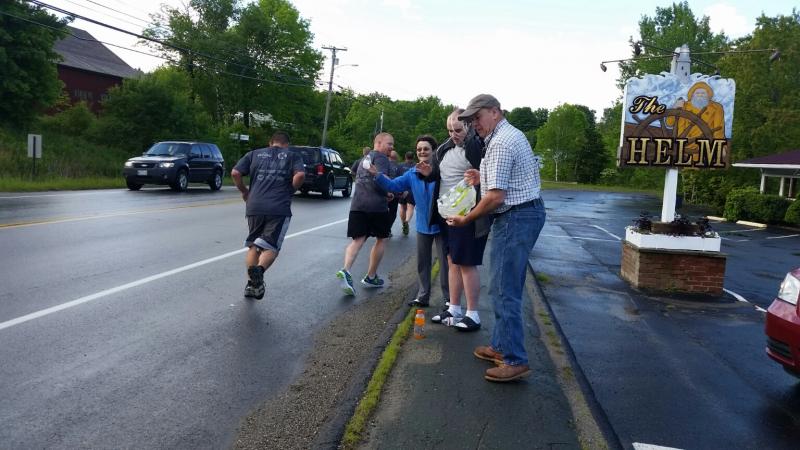 The Wiley family supplied water along the route to keep the runners hydrated. (Photo by Sarah Shepherd)