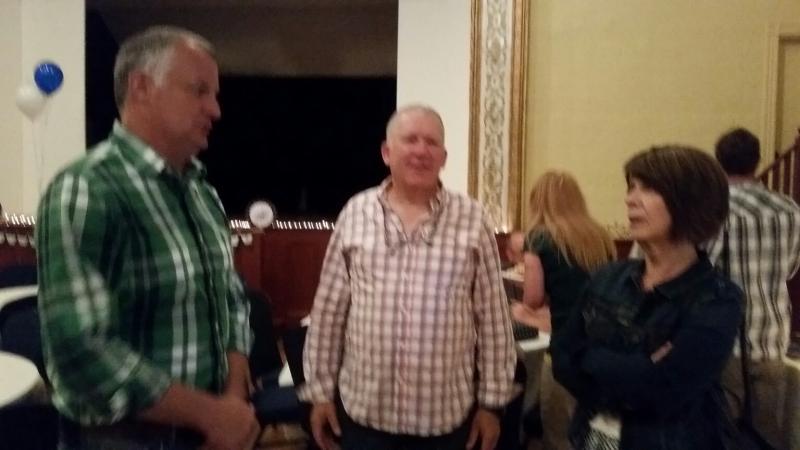 Chris Farley, Camden Fire Chief, chats with Elliot Shepherd, of Grand Manan Island, and Lois Irvine, of Saint John, NB, who traveled down the coast to celebrate with their friend, Mark Kelley. (Photo by Sarah Shepherd)