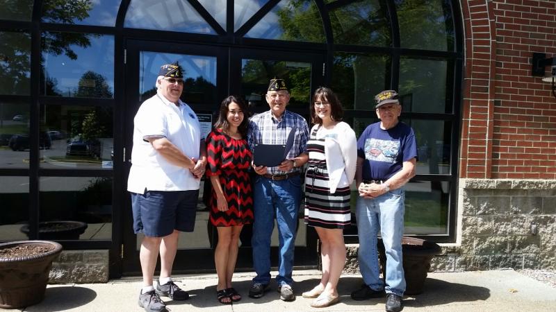 Jala Tooley, teller at the Camden Branch of Bangor Savings, accepts a certificate of recognition from Frank Carr, Commander of the American Legion Post No. 30 in Camden. Pictured from left are Jeff Sukeforth, Post Adjutant, Tooley, Carr, Brynne Hanna, Assistant Branch Manager, Camden Bangor Savings, and Kip Stinson, Legionnaire. (Photo by Sarah Shepherd)