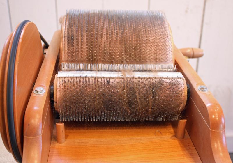 After carding the fleece, it’s combed to straighten the hair into fiber roving for spinning. (Photo by Holly S. Edwards)