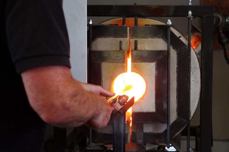 The ‘glory hole’ furnace is the working furnace, in which blown glass is reheated between steps in the process. (Photo by Holly S. Edwards)