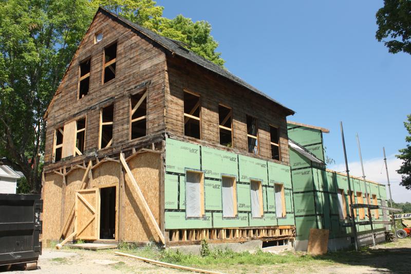 The building today has been torn down to the bare bones, but after the renovation, every bit of saved trim will be put back on so that the building looks just like it in its heyday. (Photo by Holly S. Edwards)