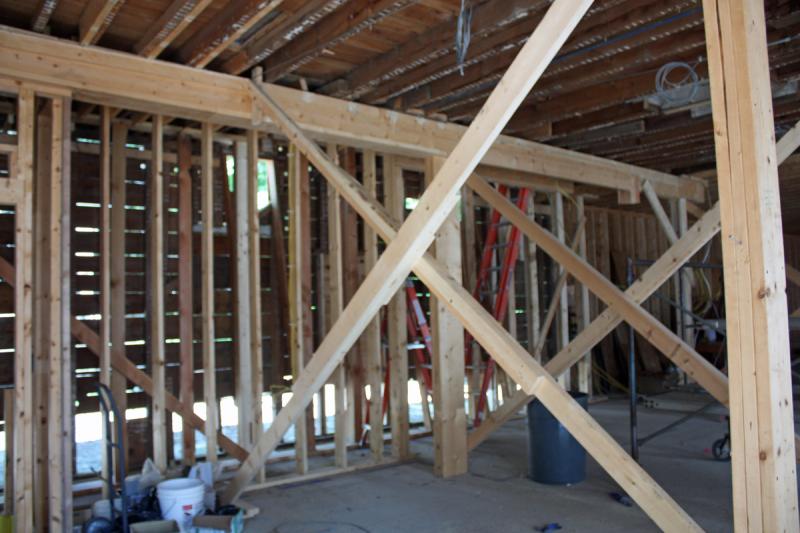 The west wall has been shored up and degraded to a point that the entire wall will need to be replaced. On the inside, framing has been installed to maintain the structure ahead of that replacement work, according to Brian Patterson of Cold Mountain Builders. (Photo by Holly S. Edwards)
