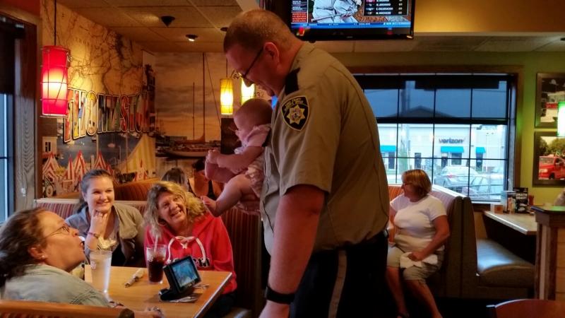 Justin Hills, Knox County Sheriff’s Office Deputy and his daughter, Emeline. (Photo by Sarah Shepherd)