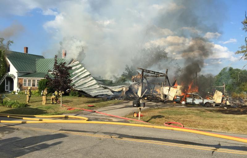 The roof of the el eventually collapsed after fire burned the structure beneath it. (Photo by Holly S. Edwards)