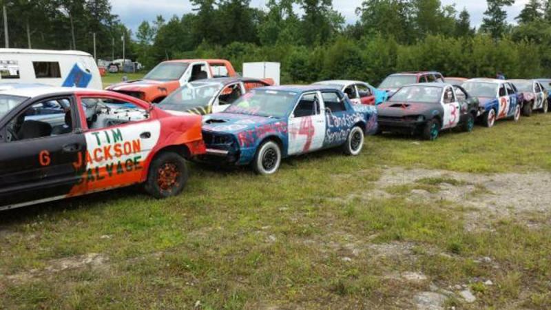 Demo derby cars line up prior to the race at the Union Fair. Each car undergoes a 40-point safety inspection. (Photo courtesy Jaden Eaton)