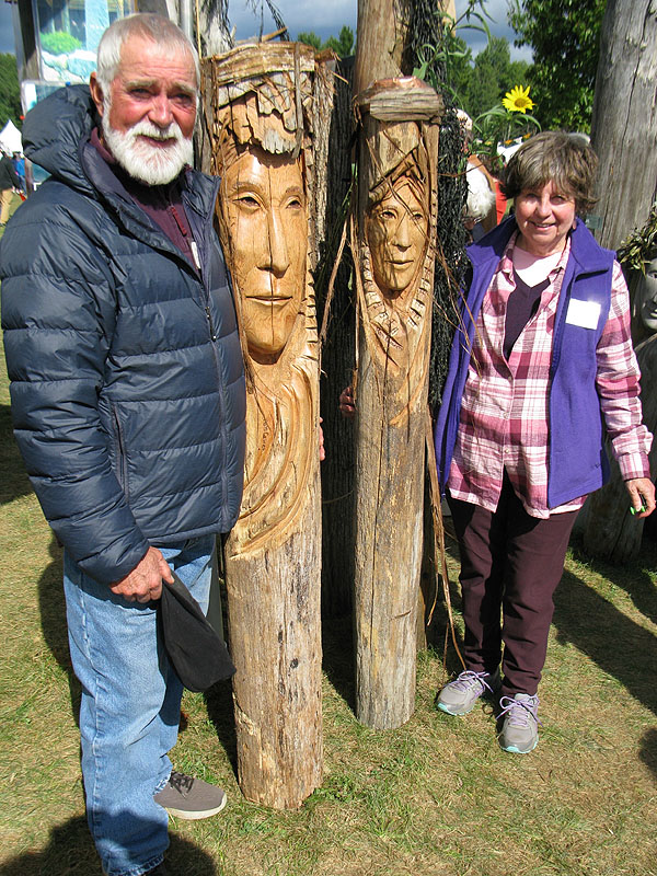 Ron and Cheryl Cowan with Ron’s carvings at Common Ground Fair.
