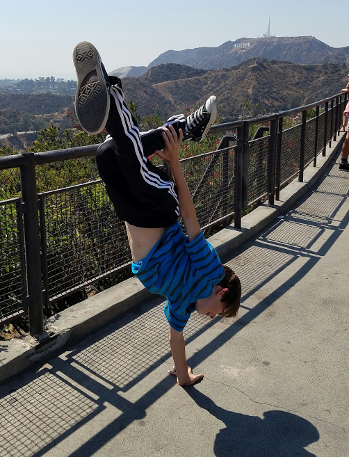 Doing a dance trick at the observatory and overlook of the Hollywood sign (which can just be seen in the background). (Photo courtesy Gretchen Henderson)