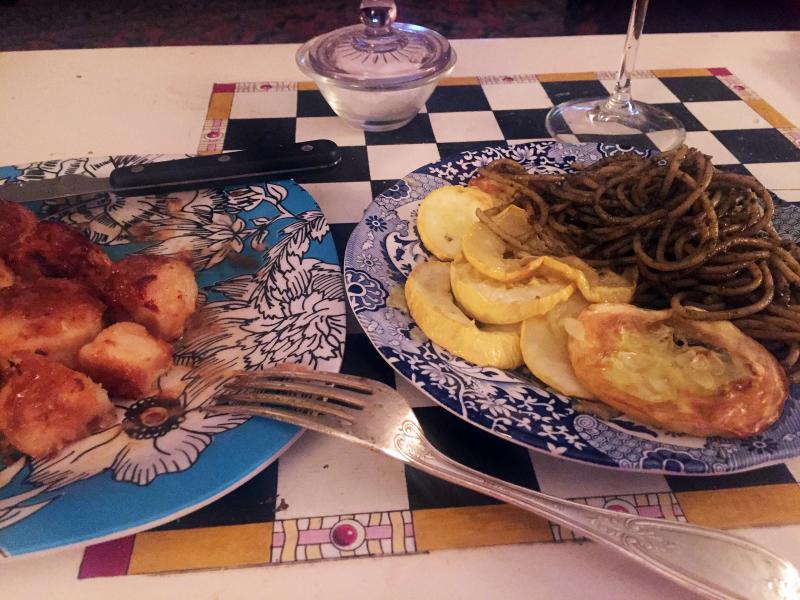 Pan-fried scallops, pesto, and fresh yellow squash from Sue Mello’s garden. And chardonnay. SUZI THAYER/Boothbay Register