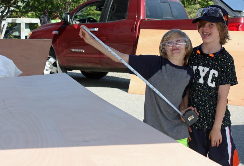 Colin and Brennan Wright of Camden ham it up before getting serious and working on their Build-a-Boat entry. (Photo by Holly S. Edwards)