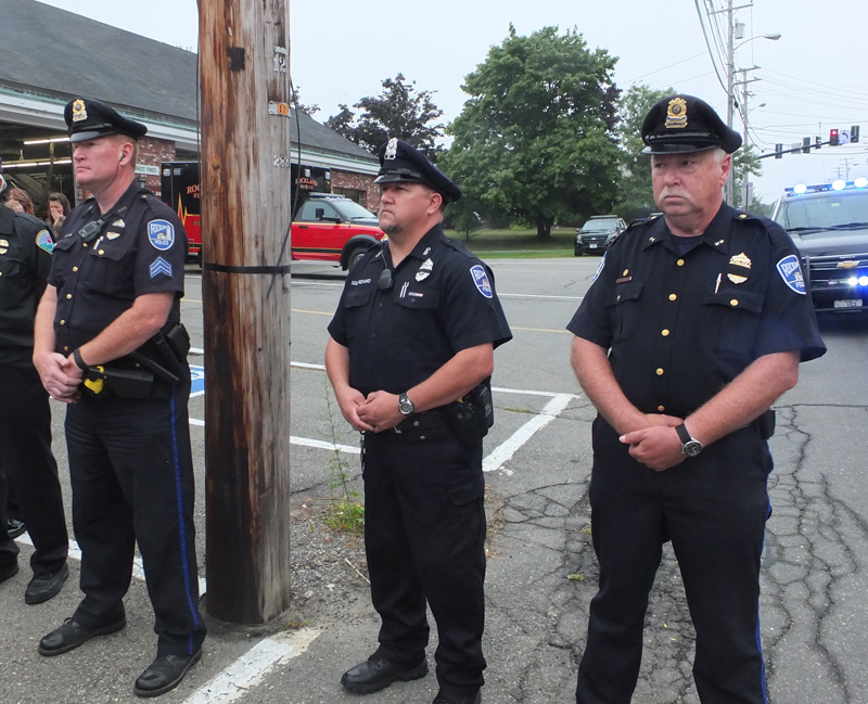 Rockland police officers Kenneth Smith, Scott Solorzano and Chief Bruce Boucher join in Sunday’s 9/11 remembrance.