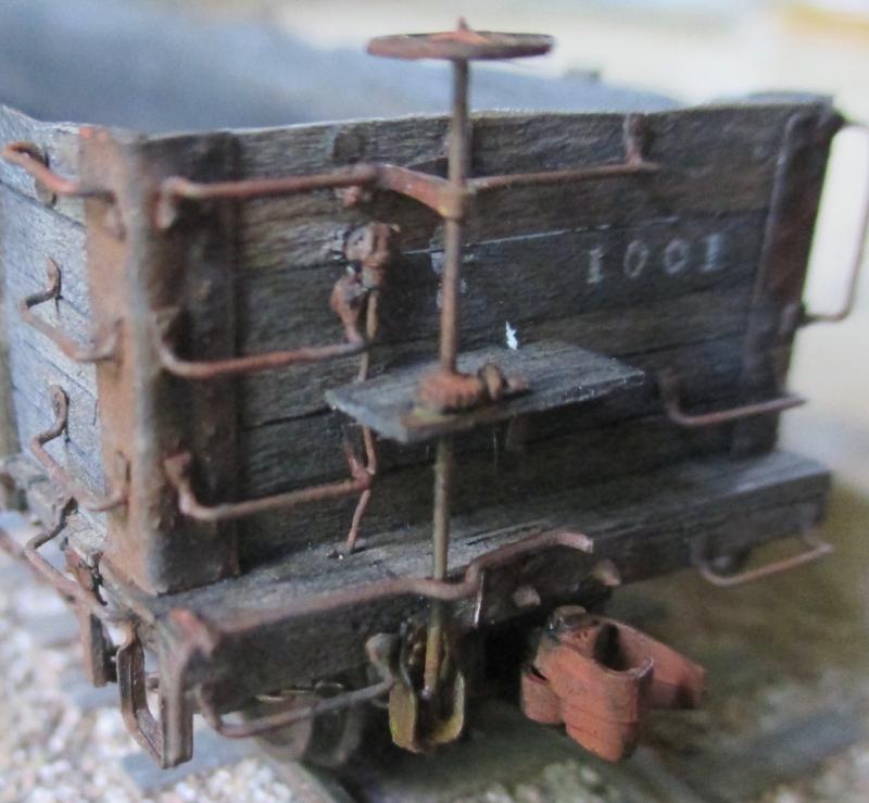 The HOn3 gondola car with air hoses attached above and missing below. The whole car isn’t much bigger than a large thumb. Almost everything was made out of either balsa wood, paper, or wire. 1980, refinished 2016. It’s even hand-lettered.