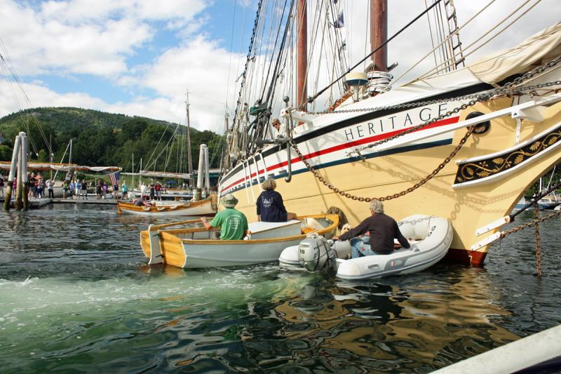 A few perfectly placed pushes are needed Friday afternoon to maneuver the schooner Heritage back into a berth on the town docks at the head of Camden Harbor at the start of the 2016 Camden Windjammer Festival. (Photo by Holly S. Edwards)