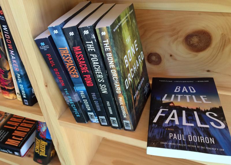 A collection of series books by Maine author Paul Doiron.
