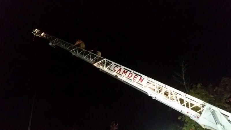 David Heath climbs the ladder with Todd Anderson of the Camden Fire Department. (Photo by Sarah Shepherd)