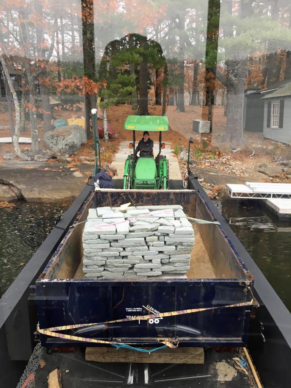 Unloading stone onto Crane Island in Megunticook Lake in Camden. (Courtesy Casey Leonard)