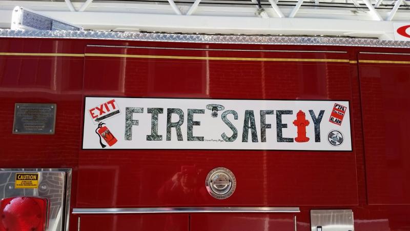 Shauna Murray’s banner is displayed on Camden’s ladder truck. (Photo by Sarah Shepherd)