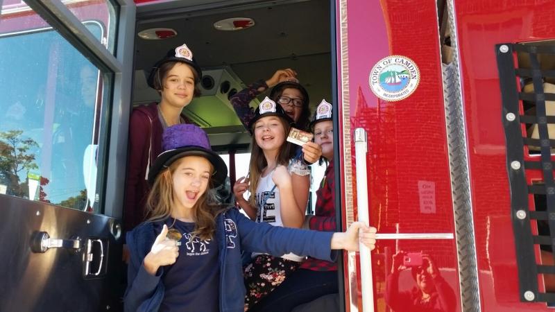 CRMS students explored the interior of a Camden firetruck during their recess time. (Photo by Sarah Shepherd)