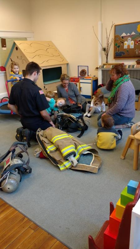 Matt Heath, firefighter, demonstrating more equipment at the Montessori School. (Photo by Chris Farley)