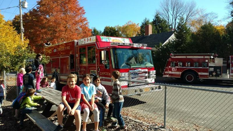 Montessori School students enjoy a visit from the Camden Fire Department. (Photo by Chris Farley)