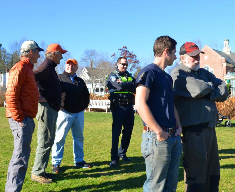 At Harbor Park, selectmen, police and firefighters keep an eye on the march. (Photo by Lynda Clancy)