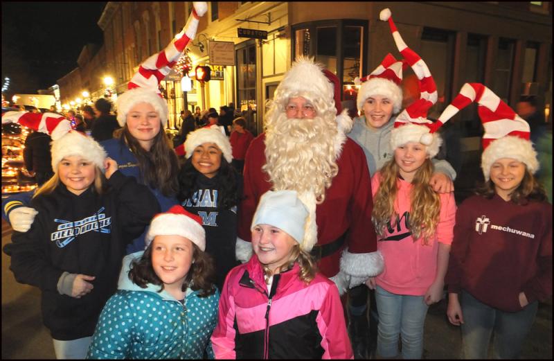 Nothing says the holiday season like Santa Claus, and the Festival of Lights had no shortage of the jolly old guy. He was mobbed by children wherever he went. (Photos by Chris Wolf)
