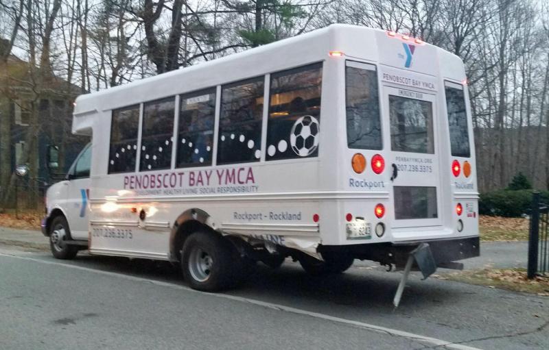 The driver’s side rear quarter panel and rear bumper of Penobscot Bay YMCA’s school bus were damaged in Wednesday’s crash on Mountain Street. (Photo by Holly S. Edwards)
