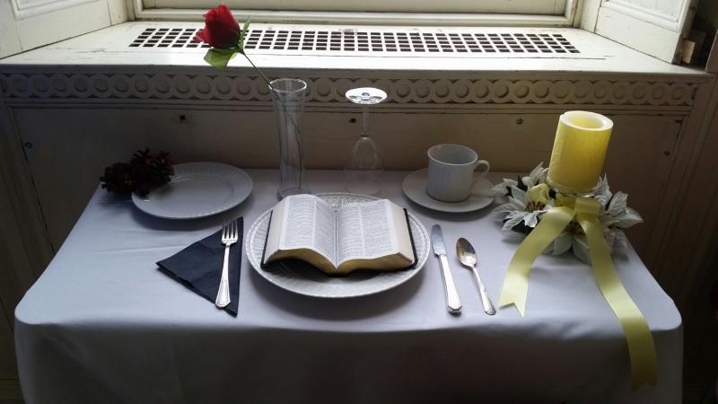 A “missing man” display features a table set with different symbols of soldiers killed or missing in action. (Photo by Sarah Shepherd)