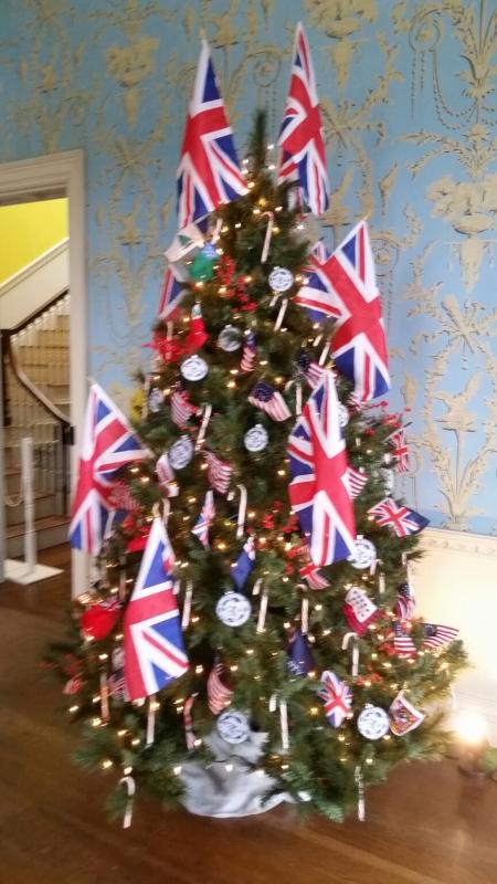 The Christmas tree in the withdrawing room at Montpelier, designed and decorated by the Lady Knox Chapter of the DAR, includes large British flags representing Lucy Knox’s heritage and small replicas of flags that flew in the American Colonies at various battles during the colonial era.(Photo by Sarah Shepherd)