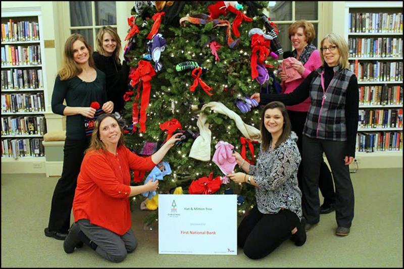 Members of the First National Bank decorate their tree at the Camden Public Library. Left side from the top: Michelle Curtis, Amanda Fisher and Carrie Rapp (in red)
Right side from top: Laura Brown-Gillman, Cheryl Jones and Brooke Fournier. (Lead photo by Ellen Curtis)