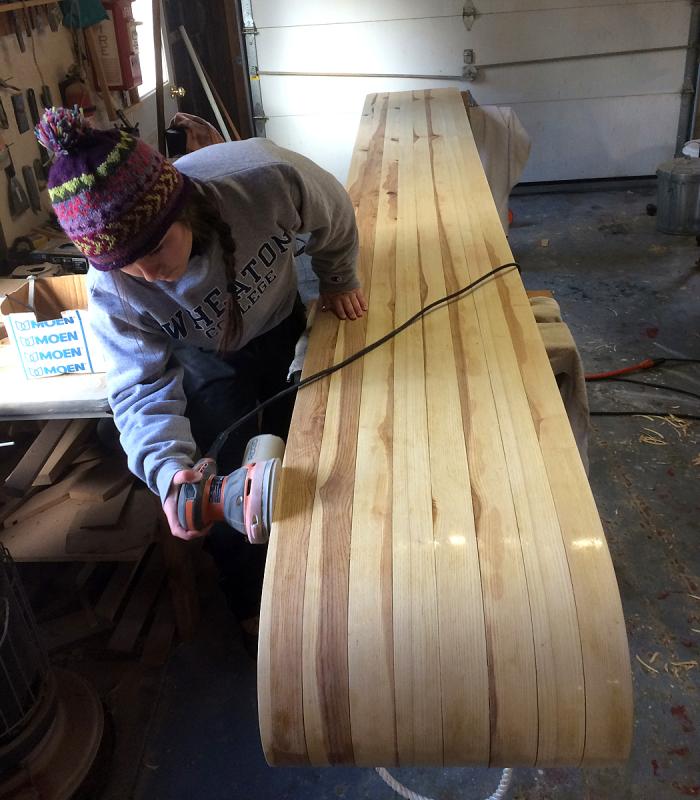Katelyn Cox, a Mt. Ararat High School senior, sands the toboggan she made for her team to race at the 27th annual U.S. National Toboggan Championships Feb. 10-12. (Courtesy Tom Cox)