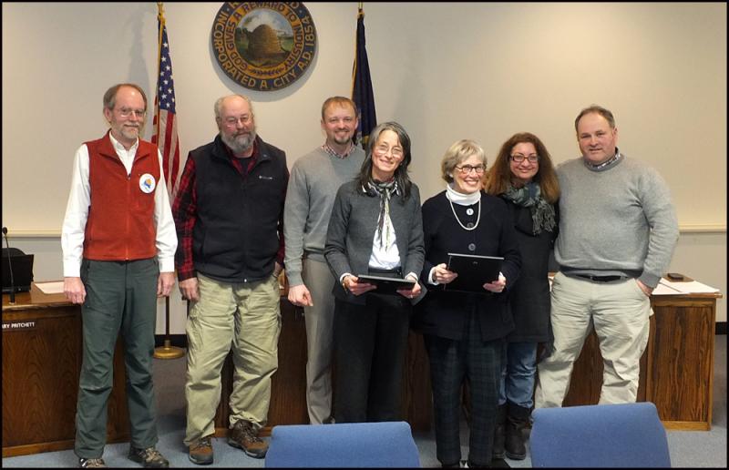 Rockland City Council members present commendations for work on the Edna St. Vincent Millay House. From left, councilors Laryy Pritchett and Ed Glaser, Mayor Will Clayton, Michelle Gifford and Ann Morris, and councilors Valli Geiger and Adam Ackor. (Photo by Chris Wolf)
