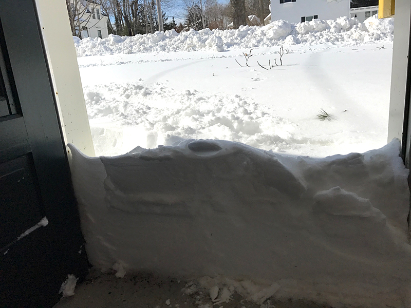Many people opened their doors to this scene, with some taking to social media to post photos of even higher walls of snow they had to shovel from the inside to get out. (Photo by Holly S. Edwards)